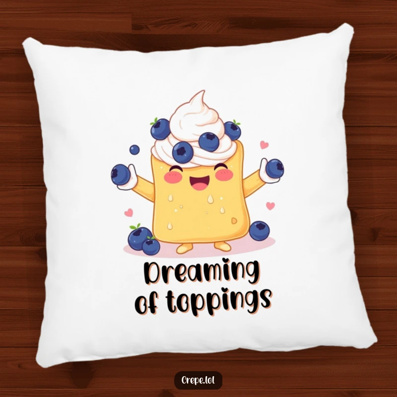 Funny pillow showcasing a delighted crepe with whipped cream arms, enthusiastically juggling a bunch of blueberries.