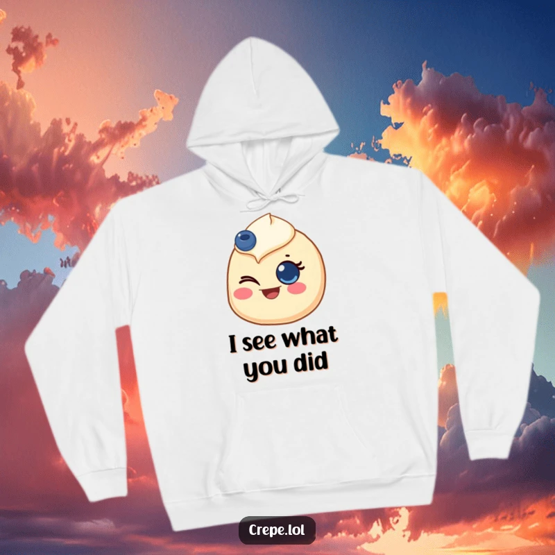 Funny hoodie featuring a whimsical crepe with a blueberry eye, caught in a joyful wink, offering cozy cheer.