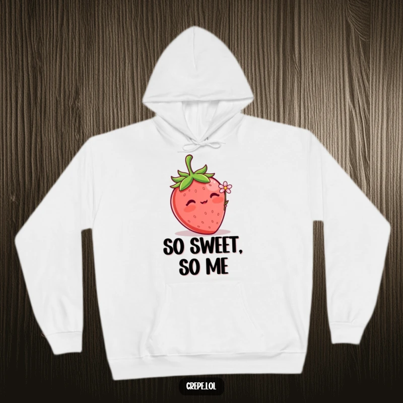 Funny Strawberry Flower Hoodie showcasing a shy blushing strawberry offering a small flower, providing cozy comfort and sweet vibes.