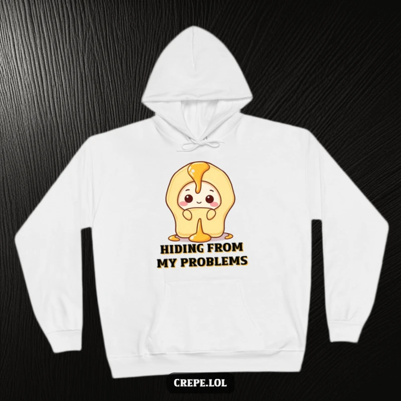 Funny hoodie featuring a shy banana crepe peeking out cautiously from behind a generous drizzle of golden syrup.