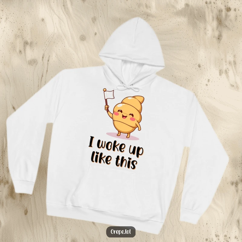 Funny croissant hoodie with a smiling, winking character waving a flag, perfect for cozy, humorous, and chic attire.