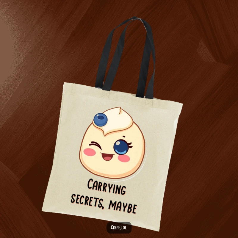 Funny tote bag showcasing a crepe with a blueberry eye, giving a joyful wink, perfect for carrying items with flair.